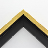 Elegant 1" floater frame. This medium bright, yellow gold floater frame has a slightly rounded profile. The gold face has a grained texture and the black interior has a satin finish.