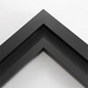 This simplistic yet modular matte black frame is designed for metal prints, acrylic prints and dry mounts. This smart design features a minimalist stepped profile that serves as a floater frame or a standard picture frame.

For the floating effect, the print can be attached on top of the inner step of the frame, without sacrificing the artwork edges.

This frame can also be used as standard picture frame. The lowered center paired with slightly raised outer lip creates a frame within a frame effect. However, due to the inner most lip of the frame, a fraction of the artwork will be hidden. But, this can be avoided with a linen liner combo.